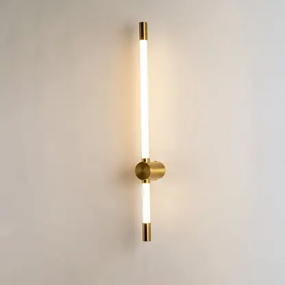 Modern gold LED wall light with warm ambient glow for elegant bedroom and luxury decor styling spaces.

