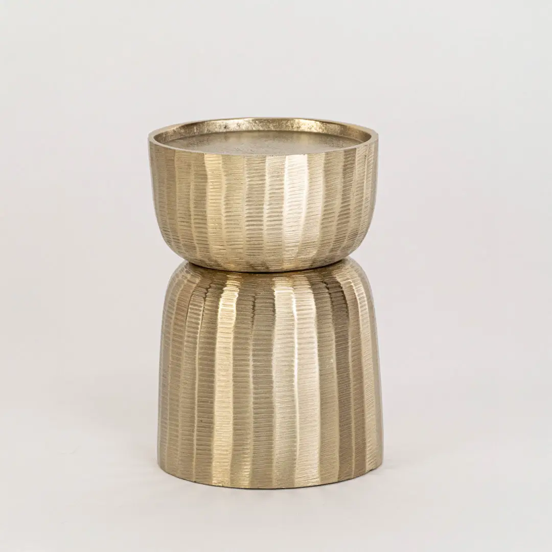 Gold metal decorative candle holder on white background with textured finish for modern tabletop decor.
