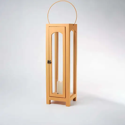 Glowing wooden garden lantern with a flickering candle inside on a white background creating a dramatic warm lighting contrast effect.