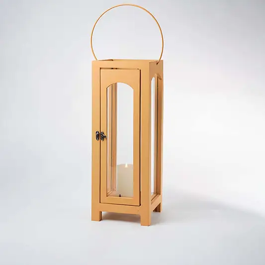 Wooden lantern with arch glass panels and round handle for rustic tabletop decor styling use.