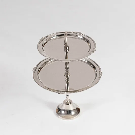 Classic metal serving stand in silver finish with tier design for dining table or serving decor accessory placement white background.