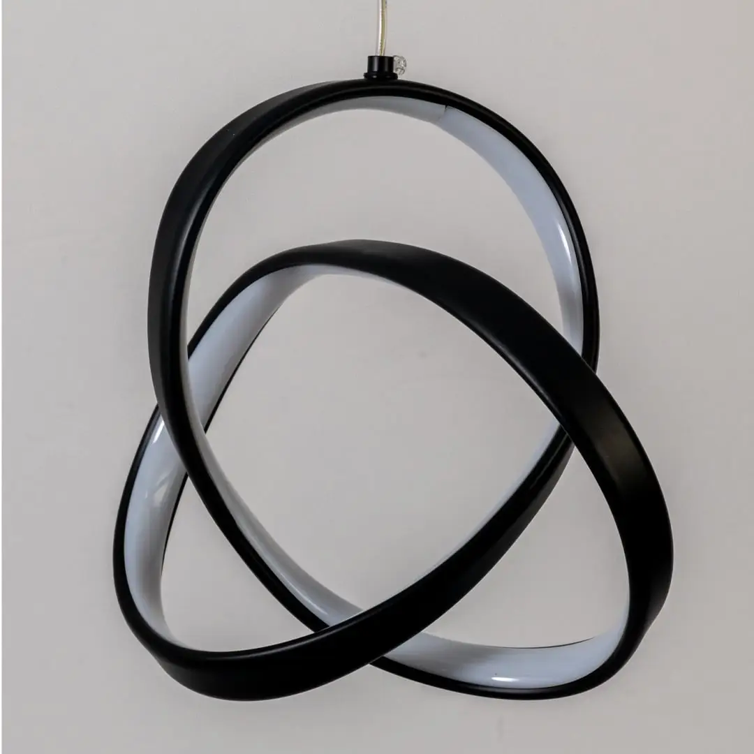 Closeup of black metal LED pendant light highlighting sculptural design and premium finish.