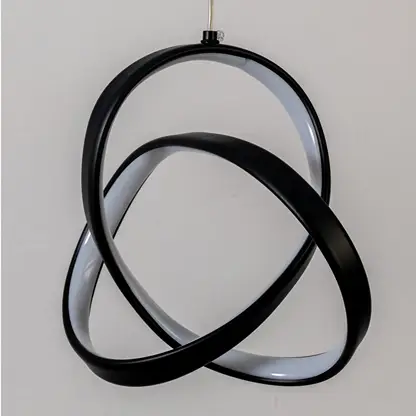 Closeup of black metal LED pendant light highlighting sculptural design and premium finish.