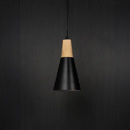 Modern pendant light bulb off on black background with black conical metal shade and natural wooden top for interiors.