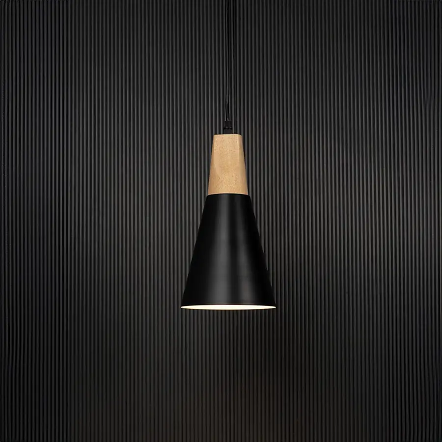 Black metal pendant light with wooden top and conical shade glowing on black background for modern home interiors.
