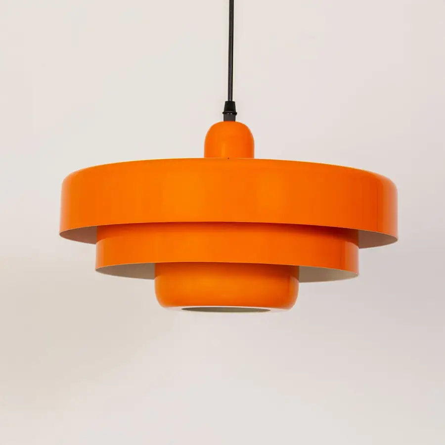 Orange metal pendant light with tiered profile for bedroom dining room and stylish ceiling decor.