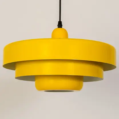 Yellow metal pendant light with layered shade design for kitchen island dining room and ceiling decor.