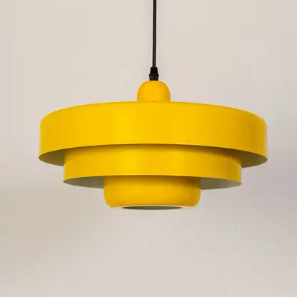 Yellow metal pendant light with layered shade ideal for kitchen dining room and ceiling decor.