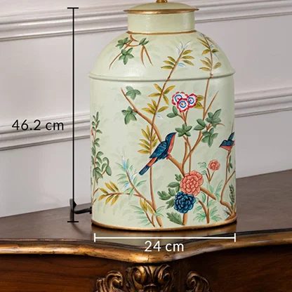Table lamp dimension image displaying cream ceramic base with bird artwork and labeled height and diameter details.