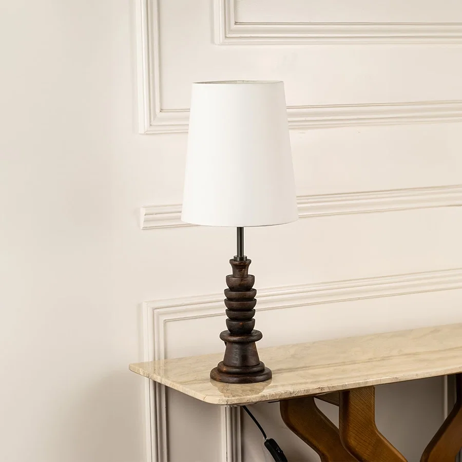Dark wooden table lamp with white tapered shade shown switched off on a clean white background highlighting its elegant modern shape suited for interior decor.