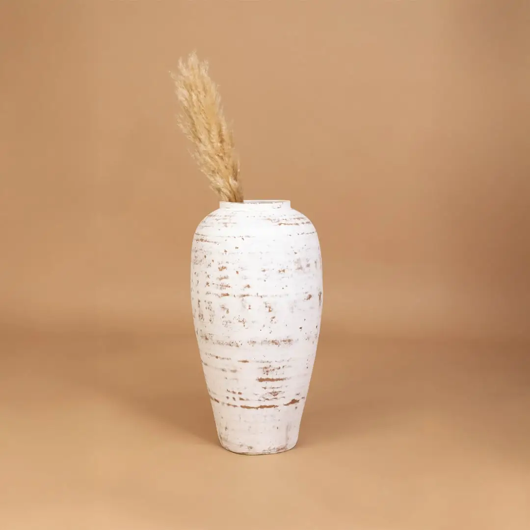 White rustic decorative vase placed in a curated room setting enhancing consoles shelves and living spaces with natural artistic decor.