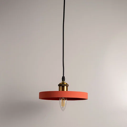 Terracotta orange metal pendant light with flat disc shade designed for stylish modern interiors.
