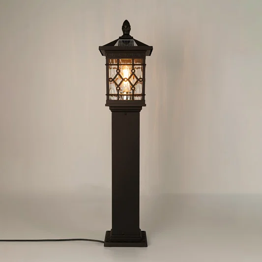 Vintage black solar outdoor gate light with glowing panels for luxury exterior decor styling use.