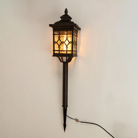 Vintage black outdoor wall light with glowing lattice panels for luxury exterior decor styling use.