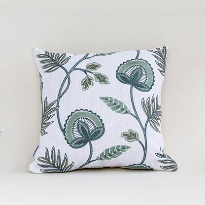 White cotton cushion cover with blue floral botanical print for sofa bedroom seating and stylish home decor accents.