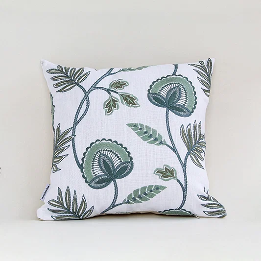 White cotton cushion cover with blue floral botanical print for sofa bedroom seating and stylish home decor accents.