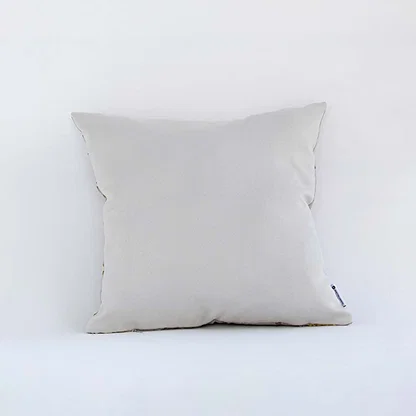 Side view of the floral embroidered cushion showcasing its filled shape and elegant stitched pattern.