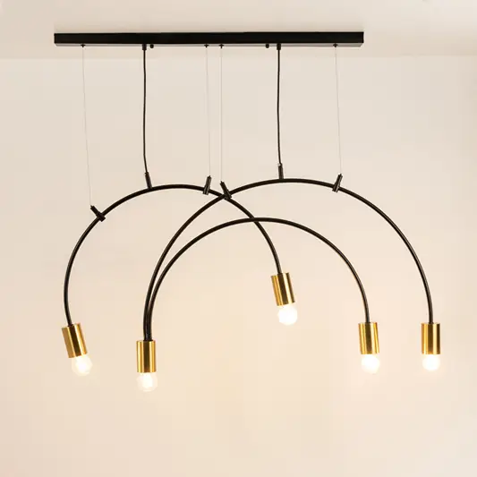 Black and gold metal arc chandelier with illuminated tube shades creating striking modern ceiling lighting for interiors.