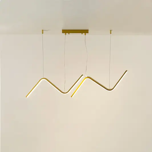 Gold metal zigzag LED pendant light with integrated illumination creating artistic modern ceiling lighting indoors.