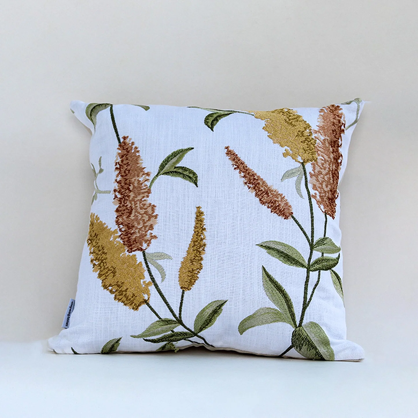 White cotton cushion cover with golden botanical leaf print for sofa couch bedroom and stylish contemporary home decor.