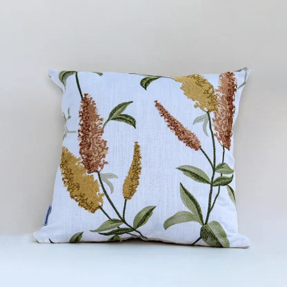White cotton cushion cover with golden botanical leaf print for sofa couch bedroom and stylish contemporary home decor.