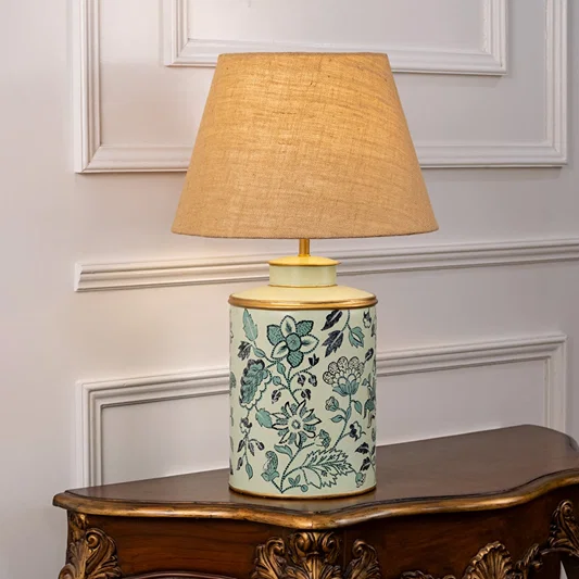 Wild Roses patterned light illuminated on white background showing floral detailing soft light diffusion and charming interior decor style.
