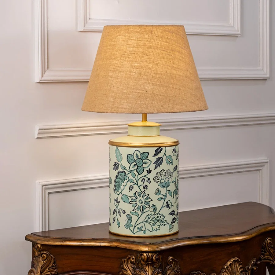 Wild Roses patterned light illuminated on white background showing floral detailing soft light diffusion and charming interior decor style.