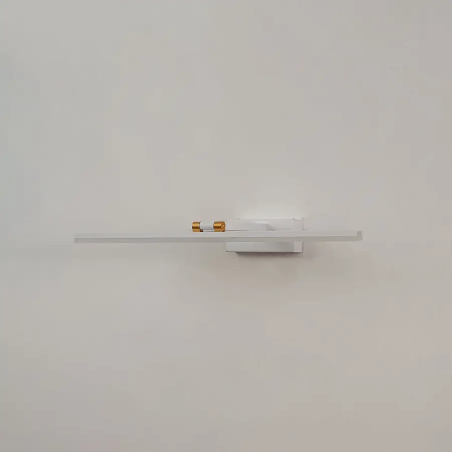 White and gold metal picture light on a white background with the light off highlighting its minimal modern design.
