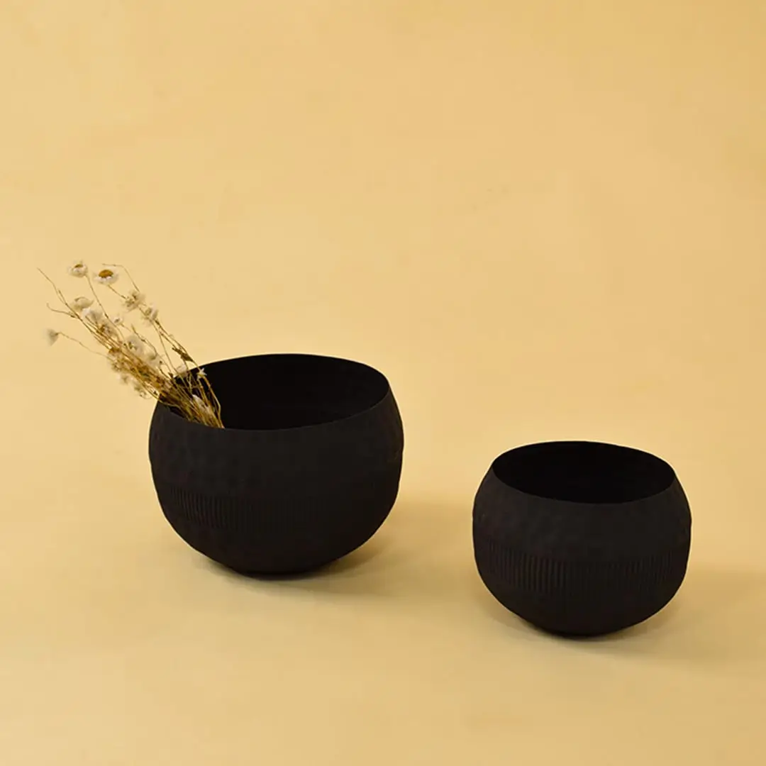 Set of black metal textured bowl decors styled together for a modern home look enhancing shelves and centre tables.
