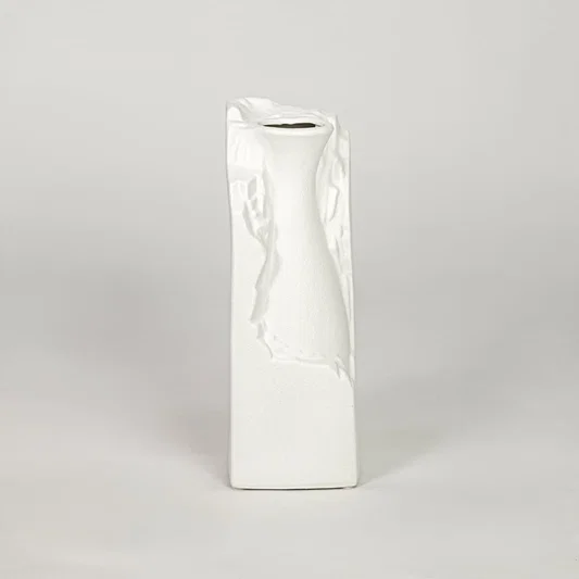 White ceramic flower vase with textured finish modern decorative vase for tabletop shelf console decor styling.