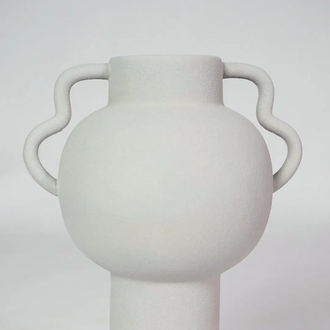 Closeup image of white ceramic handle vase for modern living room tabletop decor with smooth matte finish styling.