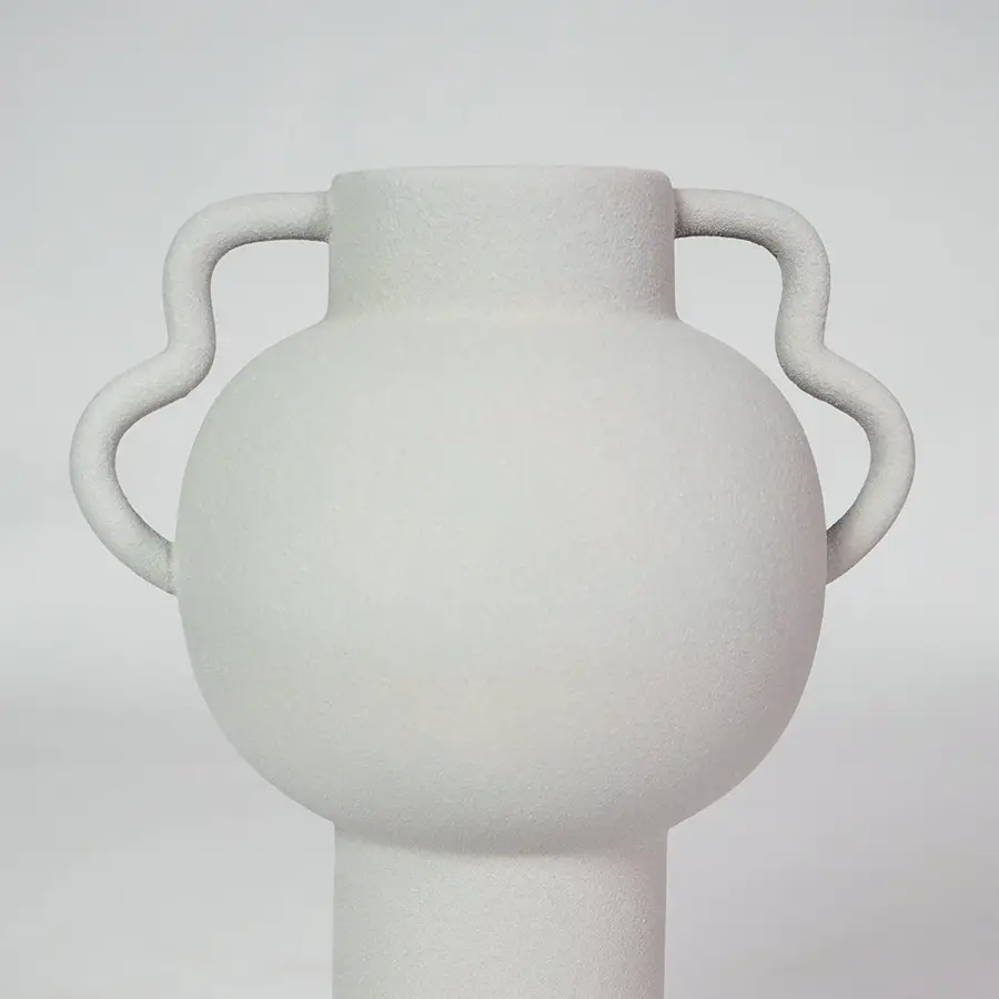 Closeup image of white ceramic handle vase for modern living room tabletop decor with smooth matte finish styling.