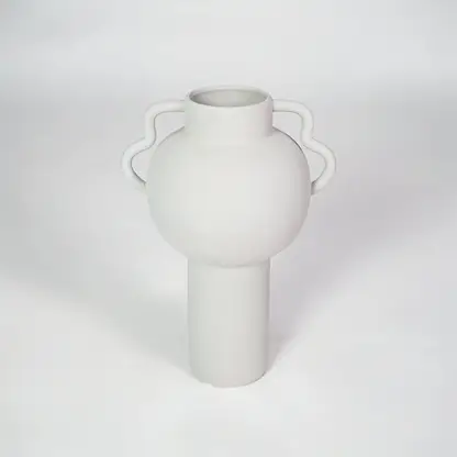 White ceramic vase with side handles for modern shelf placement and elegant indoor home decor styling accent.