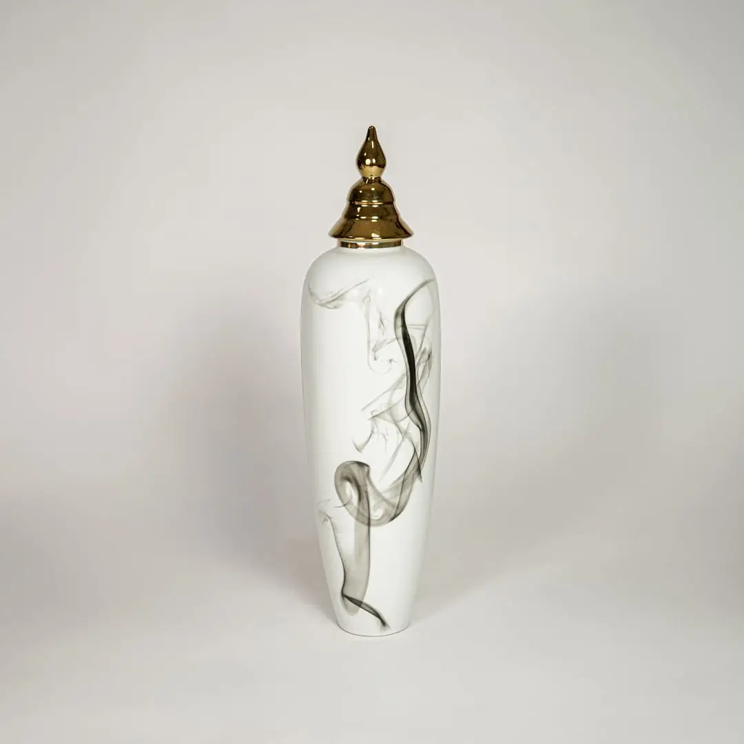 Modern white ceramic decorative floor vase with black marble swirl pattern and gold lid for luxury living room decor.