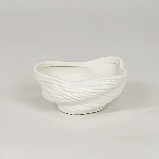 Modern white ceramic decor bowl with textured surface isolated on clean background stylish decorative bowl for center table and shelf decor.