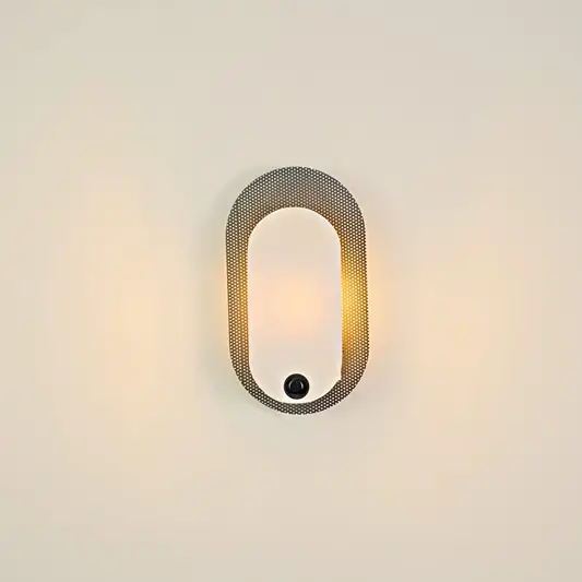 Astraea Alabaster Wall Light illuminated on white background.