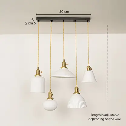 Adjustable ceramic pendant cluster with ribbed and smooth white shades and gold fittings shown with a clear hanging height guide for accurate display.