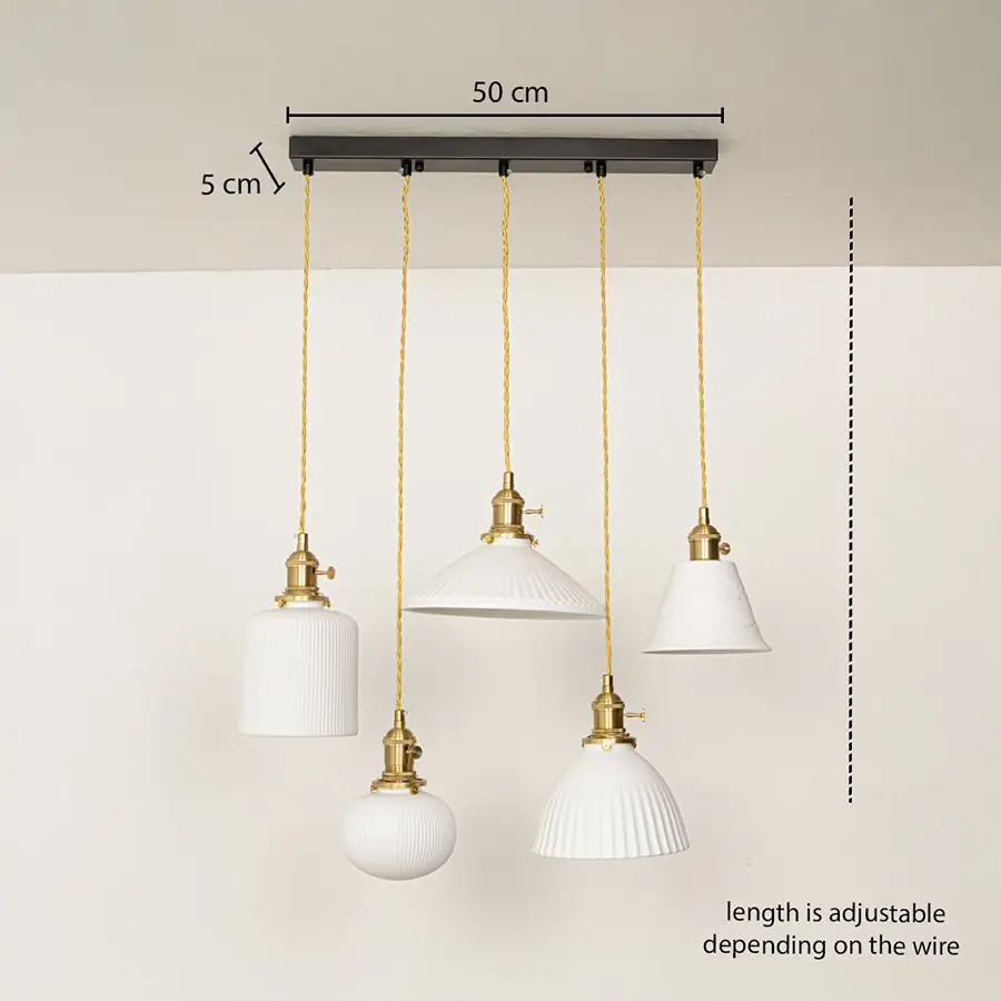 Adjustable ceramic pendant cluster with ribbed and smooth white shades and gold fittings shown with a clear hanging height guide for accurate display.