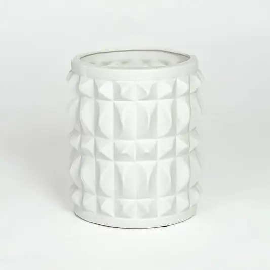 White ceramic geometric planter with raised textured pattern isolated on clean white background for modern decor styling.