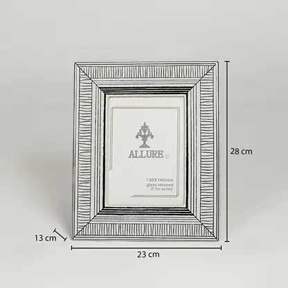 Silver metal photo frame measuring 28 cm height 23 cm width and 13 cm depth perfect for tabletop display decor.