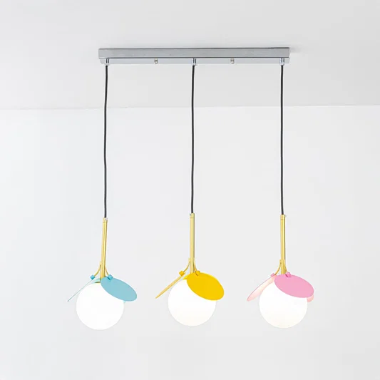 White blue yellow and pink metal pendant lights showcasing cheerful contemporary home decor.