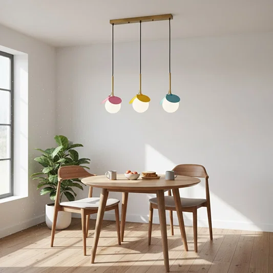 Colorful pendant lights creating playful ambience above the dining table in bright modern spaces.