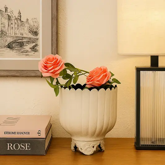 Cream metal scalloped planter decor styled in a warm modern room adding an elegant touch to living room tables and corners.