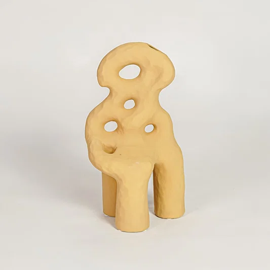 Contemporary mustard ceramic flower vase with unique sculpted design perfect for entryway table living room decor display.