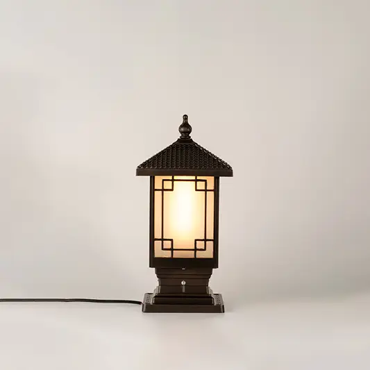 Vintage black outdoor gate light with warm ambient glow for luxury exterior decor styling use.