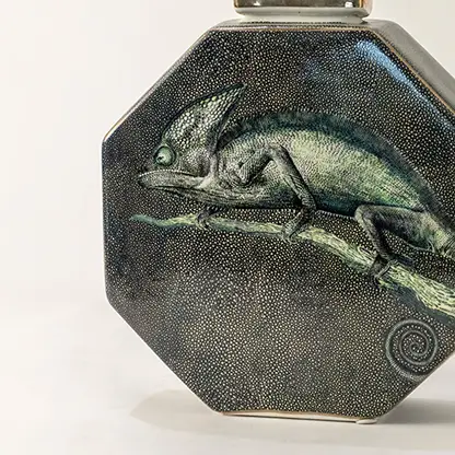 Dark green ceramic jar with engraved horse artwork in a front view perfect for rustic décor themes and stylish tabletop placement.