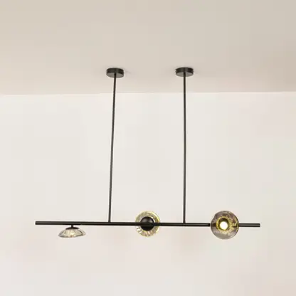 Black metal linear chandelier with circular glass accents designed for sleek modern ceiling lighting in contemporary interiors.