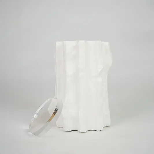 White textured ceramic candle jar for modern coffee table placement and elegant indoor decor styling accent piece.