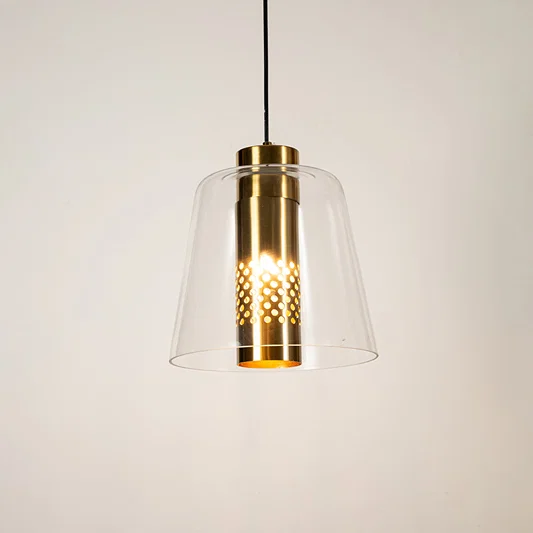 Clear glass pendant light with gold metal finish illuminated beautifully for elegant ceiling lighting decor.