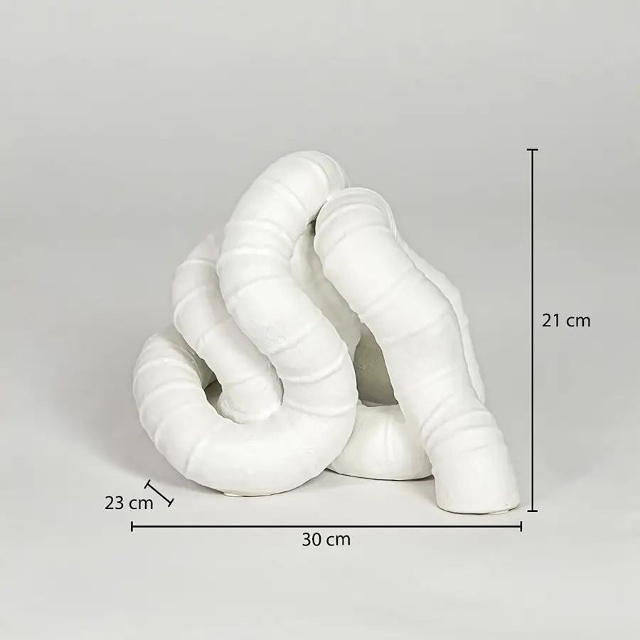 White ceramic abstract decor sculpture size 21 cm height 30 cm width 23 cm depth modern decorative showpiece for table styling.